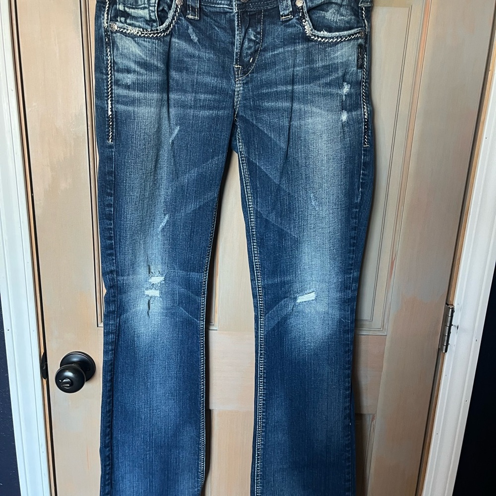 Silver Jeans Blue Boot Cut Denim with Vintage Distressing